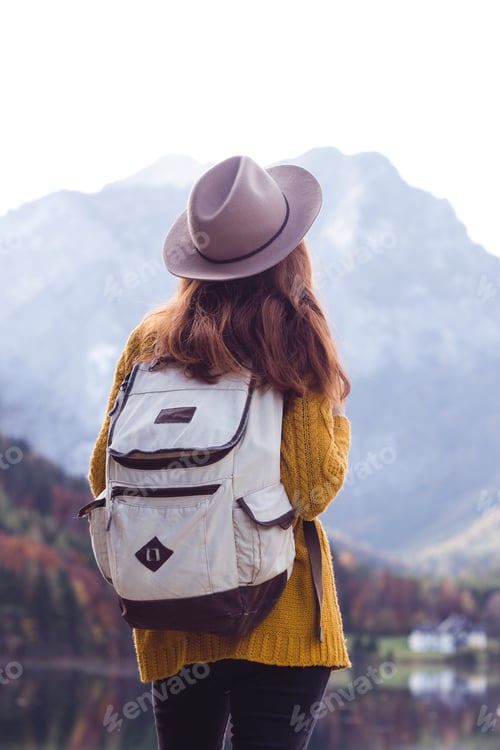 Preview: Girl With A Backpack Stands On The Shore Of A Mountain Lake