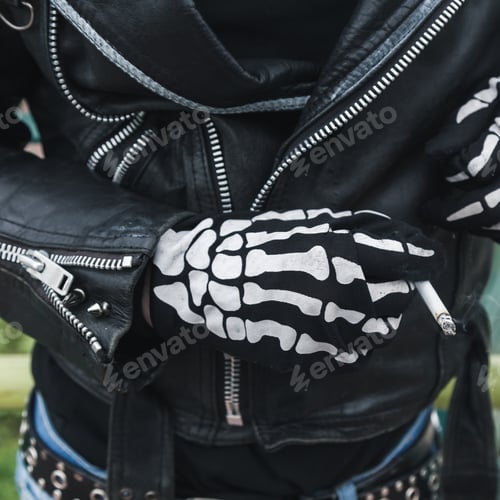 Preview: Detail Of A Guy Wearing Skeleton Gloves And Smoking Cigarette