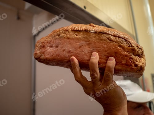 Preview: Male Hand Holding Meat Bread. Procurement For Production Master Class On Cooking Meat Dishes And