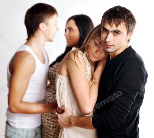 Preview: Closeup Of Two Trendy Heterosexual Young Couples Embracing, White Background.