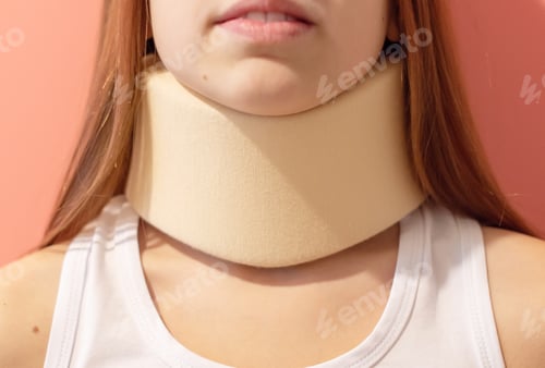 Preview: Girl In A Neck Support Collar On A Solid Pink Background