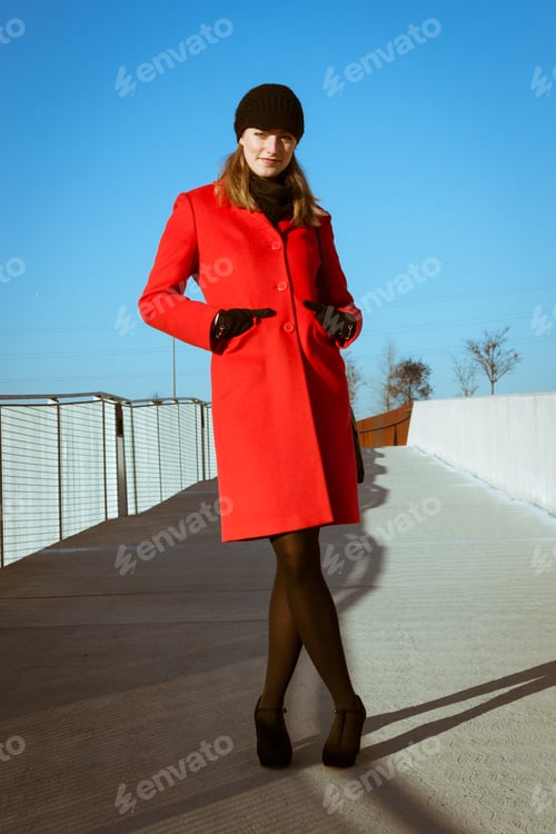 Preview: Beautiful Girl Posing In The Street With Red Coat