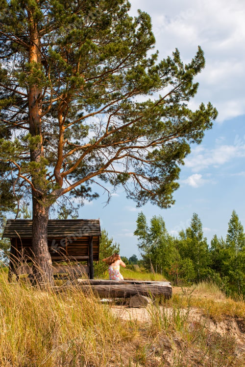 Preview: Girl Sitting On The Shore Of The Lake And Reading A Book, Ukrainian Landscape