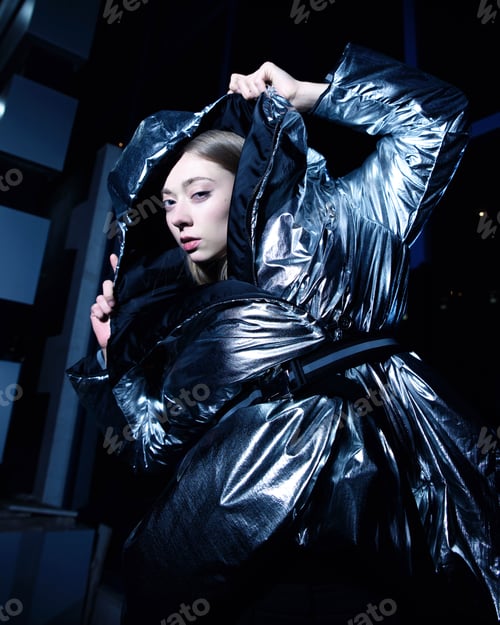 Preview: Girl Model In Silver Down Jacket, On The Street At Night.