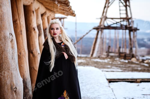 Preview: Beautiful Young Woman Holding A Viking With Blond Hair. Image Of Historical Figure