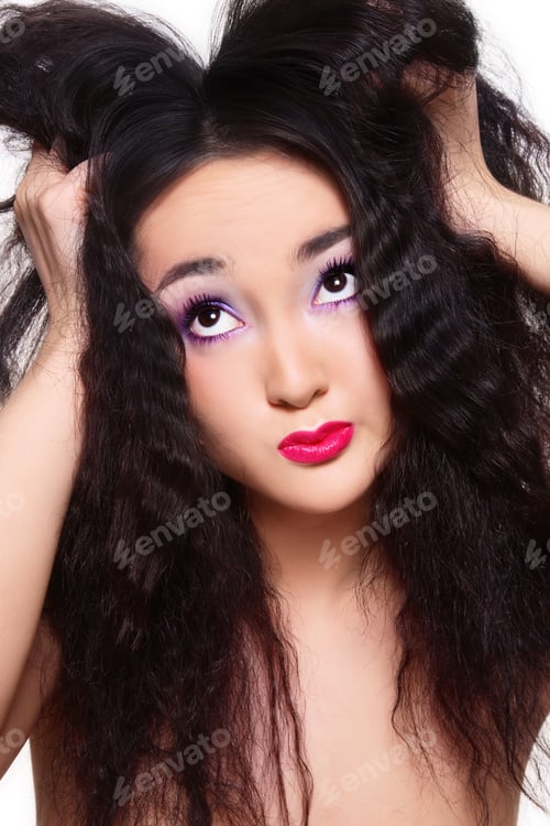 Preview: Beautiful Woman Posing with Black Hair and Makeup