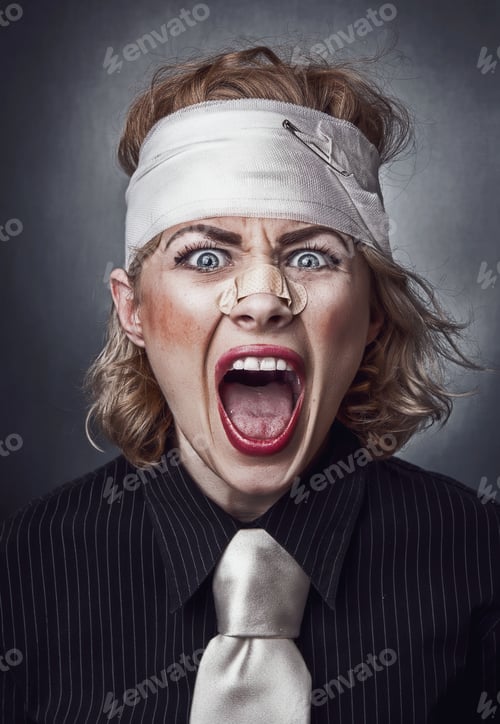 Preview: Furious Face Of Injured Woman With Bandage On Head Screaming.