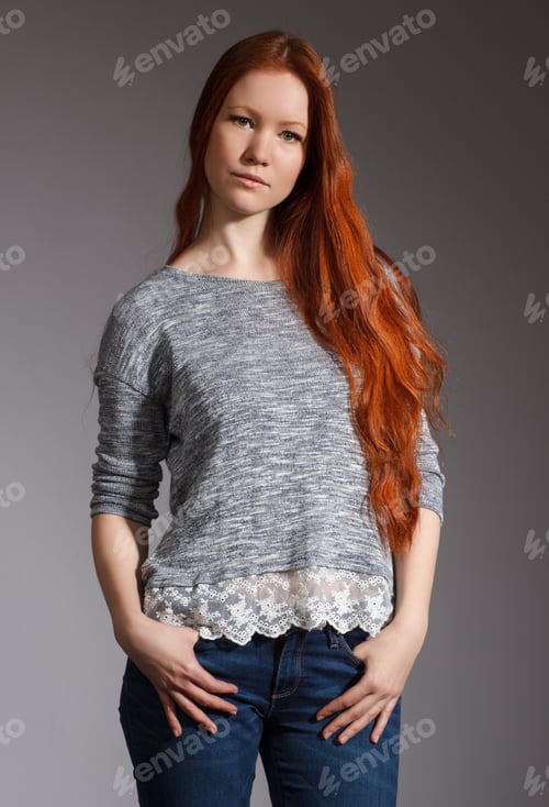 Preview: Portrait Of A Beautiful Young Woman With Red Long Hair .