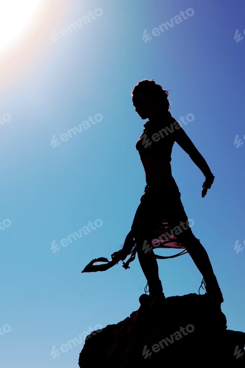 Preview: Woman Standing Against The Sun In Israel Desert