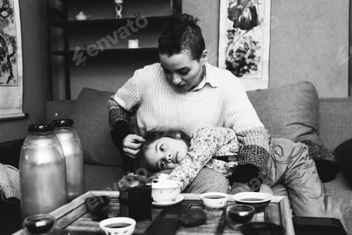 Preview: Mother With Her Beloved Daughter Resting In Coffee