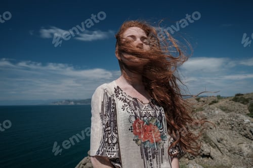 Preview: Gorgeous Romantic Girl Outdoors. Beautiful Model Near Sea. Long Hair Blowing In The Wind