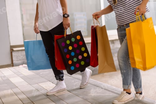Preview: Beautiful Couple Shopping In The City Walking And Holding Shopping Bags. Shopping Concept