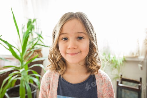 Preview: Portrait Of Smiling Little Girl Indoors With New Hairstyle, Looking At Camera