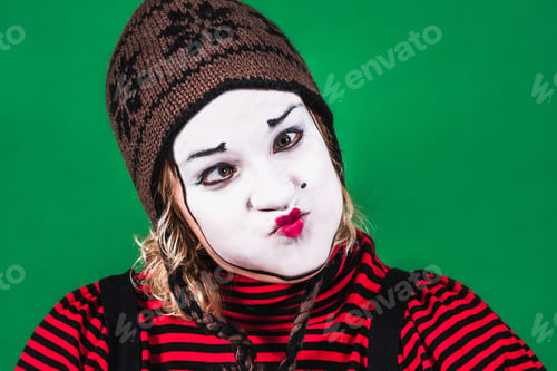 Preview: Cheerful Mime Girl Posing And Grimacing In Photo Studio