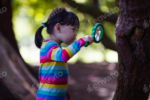 Preview: Young Girl Holding A Magnifier And Looking Up In The Summer Forest Morning