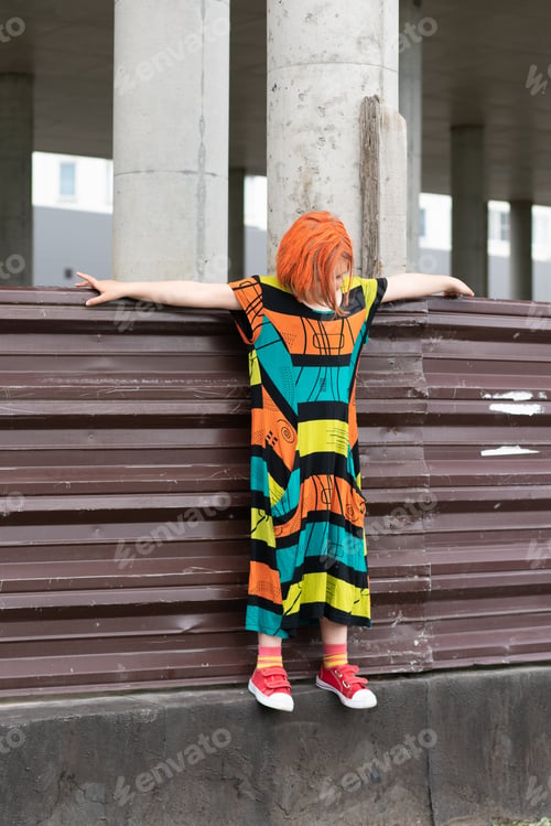 Preview: Little Girl Posing In A City Standing In A Colored Dress