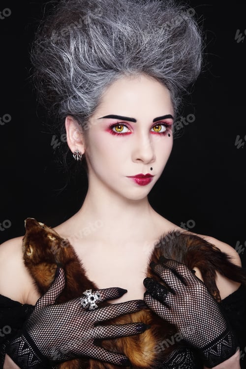 Preview: Portrait Of Young Beautiful Woman With Vintage Hairdo And Ferret In Her Hands