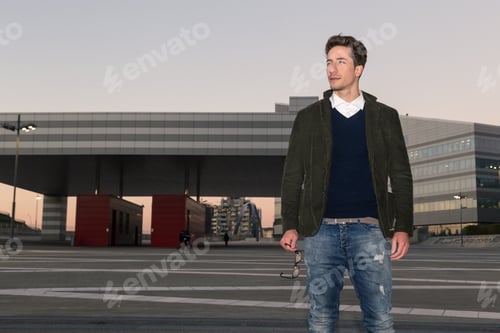 Preview: Young Handsome Man With Short Hair Posing In An Urban Context