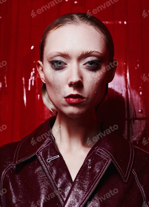 Preview: Girl Model In A Red Coat In A Bathroom With Red Walls.