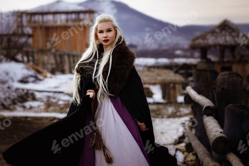Preview: Beautiful Blonde Viking Dressed In A Black Cloak Against The Backdrop Of The Castle. Beautiful Film
