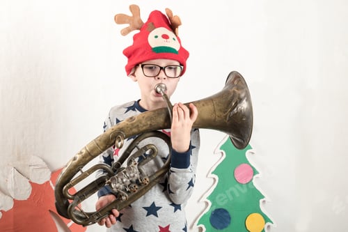 Preview: Happy Child Playing At Home. Funny Guy On Christmas Eve. Christmas Winter Vacation. The Boy Takes
