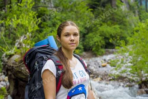 Preview: Caucasian Hiker Woman On Trek In Mountains With Backpack Living A Healthy Active Lifestyle. Hiker