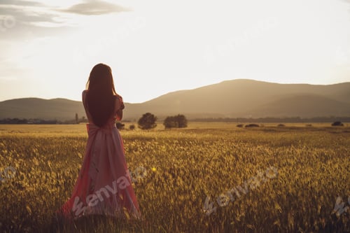 Preview: Beauty Romantic Girl Outdoors. Beautiful Teenage Model Dressed In Long Pink Dress On The Field In