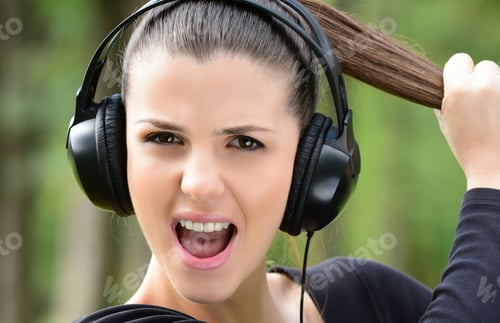 Preview: Female Student Girl Outside In Park Listening To Music On Headphones