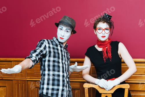 Preview: Two Mimes Showing Emotions On The Wall Background