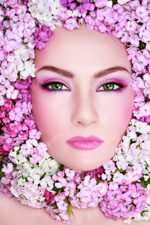 Preview: Portrait Of Beautiful Woman With Bright Makeup And Flowers Around Her Face