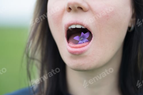 Preview: Girl Holding A Flower In Her Mouth