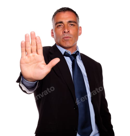 Preview: Portrait Of A Hispanic Senior Man Giving The High On Black Suit Against White Background
