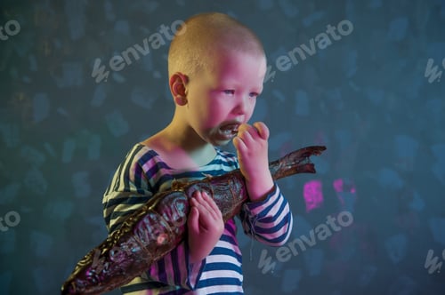 Preview: Little Blond Boy Shows Big Smoked Fish. Child Wants To Catch Big Fish In River. Concept Of Organic