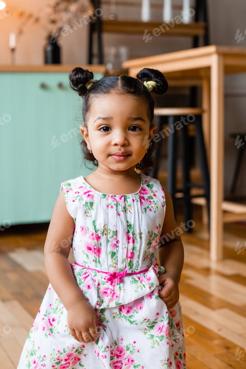 Preview: Cute Little African American Girl At Home In The Kitchen