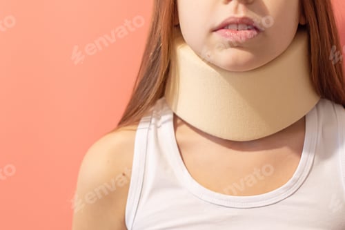 Preview: Girl In A Neck Support Collar On A Solid Pink Background