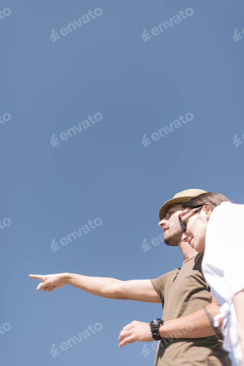 Preview: Love Couple Resting On Pier, Man Pointing At Lake