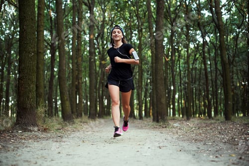 Preview: Young Caucasian Female Running In Park. Female Jogging In Park