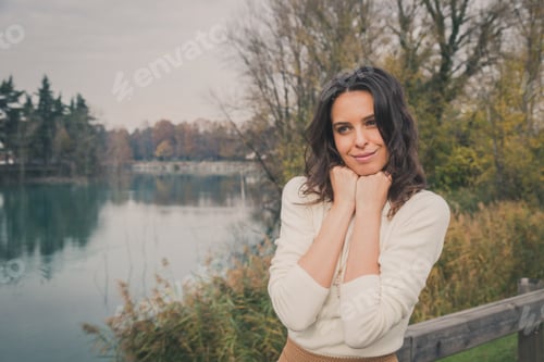 Preview: Beautiful Young Woman With Long Hair Posing In A City Park
