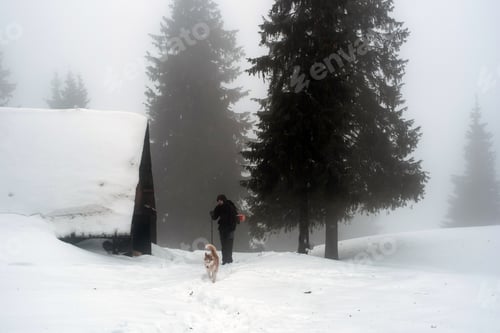 Preview: Male Hiking With Siberian Husky Dog In Mountains