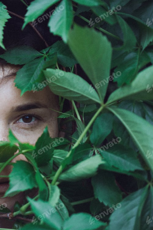 Preview: Portrait Of A Girl In The Leaves Of Wild Grapes. Natural Background