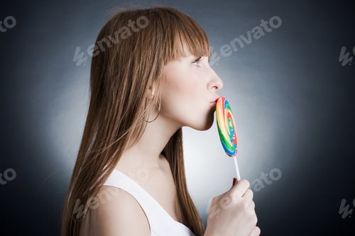 Preview: Cute Woman With Bright Candy. Studio Shot