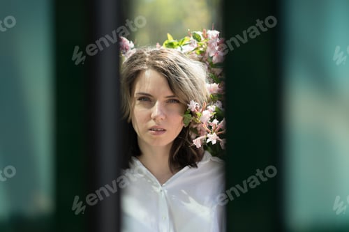 Preview: Portrait Of A Young Beautiful Girl In A Bush Of Flowers