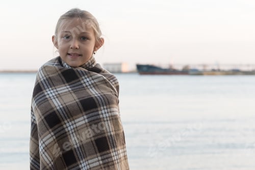 Preview: Caucasian Little Girl In Poncho On Background Of Passing Ships. Volga Don Shipping Canal. South Of