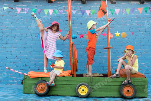 Preview: Three Happy Children Boys And Funny Girl Are Playing On Ship Made From Old Fishing Boat. Brothers