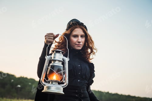 Preview: Witch With Light On A Swamp. Witch Practicing Magic On A Swamp. Halloween Concept