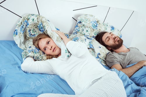 Preview: Young Caucasian Couple In Bed. Male Snoring And Female Can Not Sleep