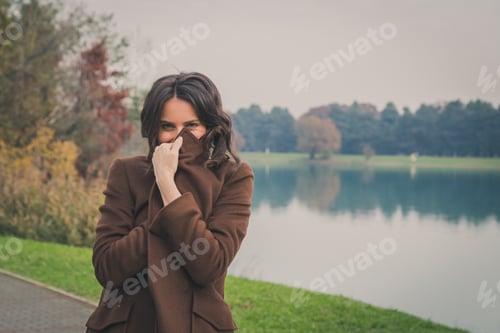 Preview: Beautiful Young Woman With Long Hair Posing In A City Park