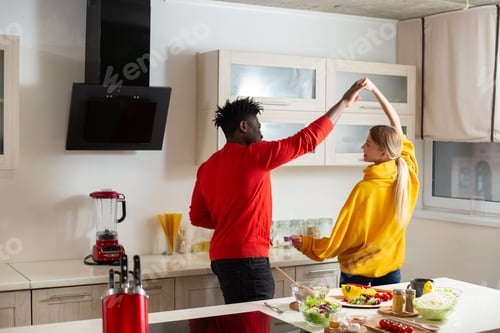 Preview: Young Man And Woman In Colorful Sweaters Feeling Relaxed And Smiling While Holding Hands And