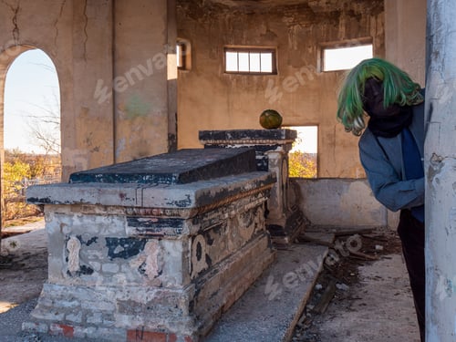 Preview: Man In Ghost Costume With Green Hair And A Black Face. Halloween At Cult Site Of Mortuary. Ancient