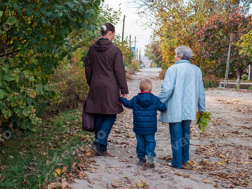 Preview: Family On Walk. Grandmother, Mother And Child Walk Along Alley In Village. Autumn And Fallen Leaves